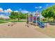 Community playground with slides and climbing structure offers outdoor fun at 43298 W Delia Blvd, Maricopa, AZ 85138