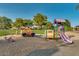 Playground with a truck and additional play equipment at the Villages at Rancho El Dorado in Maricopa Arizona at 43298 W Delia Blvd, Maricopa, AZ 85138