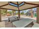 Covered picnic tables offer a shady place to relax near the playground at 43298 W Delia Blvd, Maricopa, AZ 85138