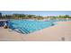 Large community pool with clear blue water, providing residents a refreshing escape and recreational fun at 43298 W Delia Blvd, Maricopa, AZ 85138