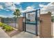 Community pool entrance with secure gate and posted pool rules for residents at 43298 W Delia Blvd, Maricopa, AZ 85138