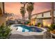 Backyard pool showcases an inviting pool surrounded by lush desert landscaping at 43298 W Delia Blvd, Maricopa, AZ 85138