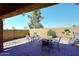 Paver patio featuring outdoor seating, a decorative wall, and desert landscaping at 45558 W Mountain View Rd, Maricopa, AZ 85139