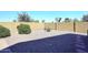 Low maintenance backyard with desert landscaping and block wall for privacy at 45558 W Mountain View Rd, Maricopa, AZ 85139