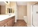 Bathroom with dual mirrors, vanity, tile floor, and a separate bathtub and shower at 45558 W Mountain View Rd, Maricopa, AZ 85139