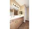 Bathroom featuring dual mirrors and sinks and a separate shower at 45558 W Mountain View Rd, Maricopa, AZ 85139