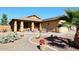 Inviting single-story home with desert landscaping and covered porch at 45558 W Mountain View Rd, Maricopa, AZ 85139