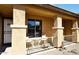 Inviting covered porch with seating area perfect for relaxing outdoors at 45558 W Mountain View Rd, Maricopa, AZ 85139