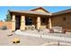 Welcoming front porch featuring desert landscaping and a cozy bench at 45558 W Mountain View Rd, Maricopa, AZ 85139