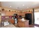 Traditional style kitchen featuring wood cabinets, a kitchen island, and stainless steel appliances at 45558 W Mountain View Rd, Maricopa, AZ 85139