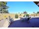 Relaxing brick patio featuring desert landscaping and beautiful sunny skies at 45558 W Mountain View Rd, Maricopa, AZ 85139