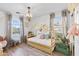 Bedroom featuring a unique bed frame, chandelier lighting, and a comfortable rocking elephant at 5110 W Fulton St, Phoenix, AZ 85043