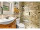 Bathroom features a tiled shower with glass door and a decorative vanity sink at 51238 N Pinal Ranch Rd, Miami, AZ 85539