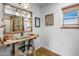 Rustic bathroom featuring trough sink, wood frame mirror, and barn wood accents at 51238 N Pinal Ranch Rd, Miami, AZ 85539