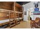 Cozy bedroom with rustic wooden bunk beds and natural light creating a unique ambiance at 51238 N Pinal Ranch Rd, Miami, AZ 85539