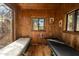 Charming cabin bedroom with rustic wood walls and tranquil views at 51238 N Pinal Ranch Rd, Miami, AZ 85539