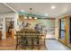 Large dining room with custom mural and access to the outdoors at 51238 N Pinal Ranch Rd, Miami, AZ 85539