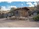 Charming rustic cabin with stone foundation and natural surroundings at 51238 N Pinal Ranch Rd, Miami, AZ 85539