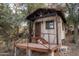 Beautiful rustic cabin with inviting porch and scenic landscape at 51238 N Pinal Ranch Rd, Miami, AZ 85539