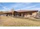 Elegant home features a spacious porch, a well-maintained lawn, and a peaceful rural setting at 51238 N Pinal Ranch Rd, Miami, AZ 85539