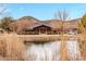 Beautiful home overlooking a tranquil pond and surrounded by picturesque scenery and natural beauty at 51238 N Pinal Ranch Rd, Miami, AZ 85539