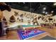 Large game room with a pool table and rustic decor at 51238 N Pinal Ranch Rd, Miami, AZ 85539