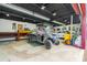 Spacious garage with a Polaris utility vehicle, tools and plenty of room for storage or working on projects at 51238 N Pinal Ranch Rd, Miami, AZ 85539
