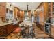 Beautiful kitchen with custom cabinets, a large island, granite countertops, and stainless steel appliances at 51238 N Pinal Ranch Rd, Miami, AZ 85539
