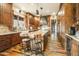 Beautiful kitchen with custom cabinets, a large island, granite countertops, and stainless steel appliances at 51238 N Pinal Ranch Rd, Miami, AZ 85539