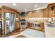 Gourmet kitchen with custom wood cabinets, stainless steel appliances, granite counters and hardwood floors at 51238 N Pinal Ranch Rd, Miami, AZ 85539