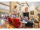 Inviting living room with a majestic stone fireplace, beautiful hardwood floors, and comfortable seating at 51238 N Pinal Ranch Rd, Miami, AZ 85539
