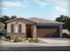 Charming single-story home showcasing a stone facade, desert landscaping, and a two-car garage at 5468 S 244Th Ave, Buckeye, AZ 85326