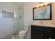 Contemporary bathroom with a glass-enclosed shower, sleek vanity, and modern fixtures at 6820 E Pinchot Ave, Scottsdale, AZ 85251