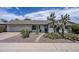 Charming single-story home featuring desert landscaping, gravel yard, and a welcoming walkway at 6820 E Pinchot Ave, Scottsdale, AZ 85251