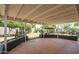 Covered patio featuring concrete floors, block planters, and a well-maintained yard at 6820 E Pinchot Ave, Scottsdale, AZ 85251