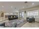 Inviting living room features glass patio doors, a decorative rug, and comfortable seating at 8110 N 18Th Pl, Phoenix, AZ 85020