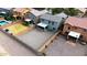 Aerial view of backyards with grass, gravel, patio and pools at 896 E Dragon Fly Rd, San Tan Valley, AZ 85143