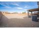 Large, gravel backyard with patio and space for customization at 896 E Dragon Fly Rd, San Tan Valley, AZ 85143