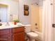 Cozy bathroom featuring a tiled shower and tub combination and oak vanity at 896 E Dragon Fly Rd, San Tan Valley, AZ 85143