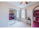 Bright bedroom featuring bunk beds, mirrored closet doors, and neutral decor at 896 E Dragon Fly Rd, San Tan Valley, AZ 85143
