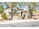 Charming two-story home with neutral exterior, complemented by desert landscaping and a welcoming entrance at 896 E Dragon Fly Rd, San Tan Valley, AZ 85143