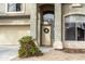 Inviting home entrance with landscaped plants and a charming front door and garage at 896 E Dragon Fly Rd, San Tan Valley, AZ 85143