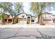 Traditional two-story home with desert landscaping, two-car garage and tree-lined street at 896 E Dragon Fly Rd, San Tan Valley, AZ 85143
