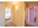 Hallway with views of bedrooms featuring neutral carpet, complementing the warm yellow wall paint at 896 E Dragon Fly Rd, San Tan Valley, AZ 85143