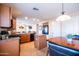 Open kitchen features an island and transitions to a breakfast nook and living area at 896 E Dragon Fly Rd, San Tan Valley, AZ 85143