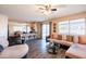 Comfortable living room with an open layout, ceiling fan, and easy access to the kitchen at 896 E Dragon Fly Rd, San Tan Valley, AZ 85143