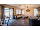Comfortable living room with an open layout, ceiling fan, and easy access to the sliding glass door at 896 E Dragon Fly Rd, San Tan Valley, AZ 85143