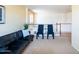 Spacious loft area includes a black futon and black chairs, offering versatile space at 896 E Dragon Fly Rd, San Tan Valley, AZ 85143