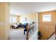 Upstairs loft with neutral walls and plush carpeting offers extra living space at 896 E Dragon Fly Rd, San Tan Valley, AZ 85143
