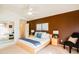 Main bedroom features a brown accent wall, neutral carpeting, and mirrored closet doors at 896 E Dragon Fly Rd, San Tan Valley, AZ 85143